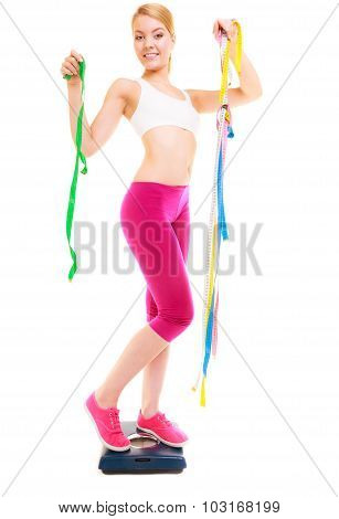 Happy Woman On Weighing Scale. Dieting Slimming.