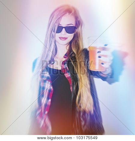 Young blonde urban woman with glass of beer