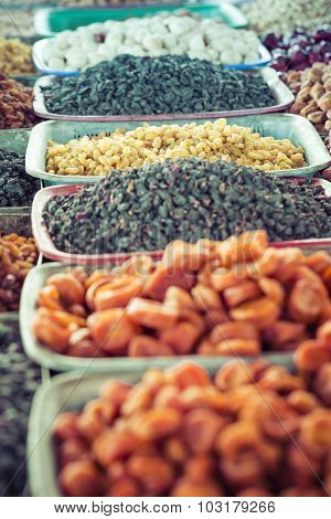 Dry Fruits And Spices Like Cashews, Raisins, Cloves, Anise, Etc. On Display For Sale In A Bazaar In
