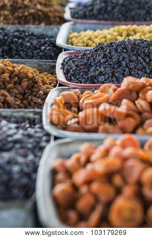 Dry Fruits And Spices Like Cashews, Raisins, Cloves, Anise, Etc. On Display For Sale In A Bazaar In