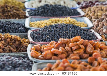 Dry Fruits And Spices Like Cashews, Raisins, Cloves, Anise, Etc. On Display For Sale In A Bazaar In
