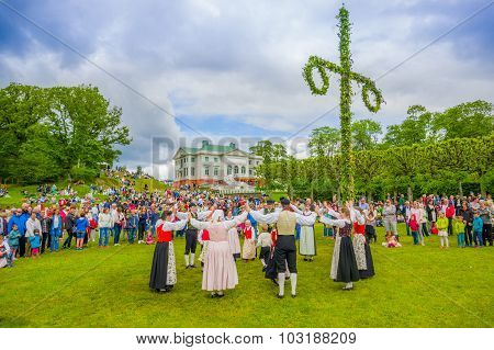 Dancing Around The Maypole In Midsummer, Gothemburg, Sweden