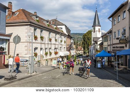 People Enjoy A Bicycle Tour In The Beautiful Historic Town Of Koenigstein