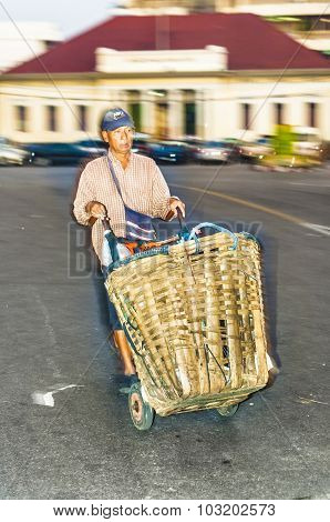 Man Drives Home With Goods On A Barrow From Night Market Pak Khlong Thalat In Bangkok