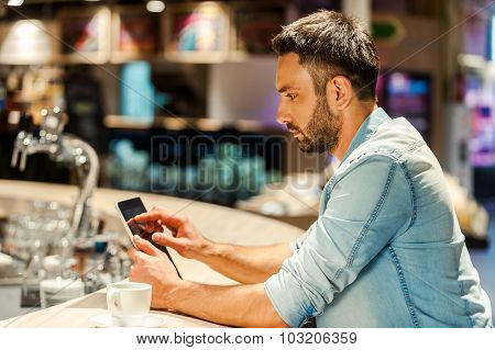 Surfing The Net In Bar.