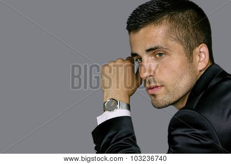 handsome young man wears a watch