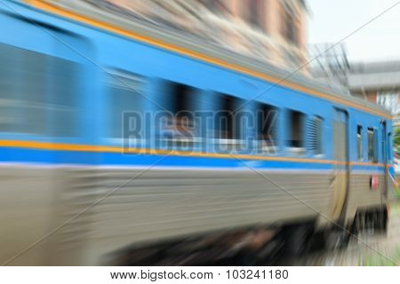 Blurred Zoom Of People On Train
