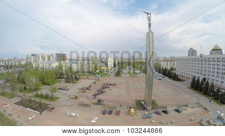 SAMARA - MAY 05, 2015: Crowd people are on Glory Square near Glory Monument at spring day. Aerial view video frame