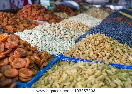 Dry Fruits And Spices Like Cashews, Raisins, Cloves, Anise, Etc. On Display For Sale In A Osh Bazaar