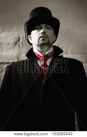 Man In The Black Coat, Top Hat And In A Red Tie
