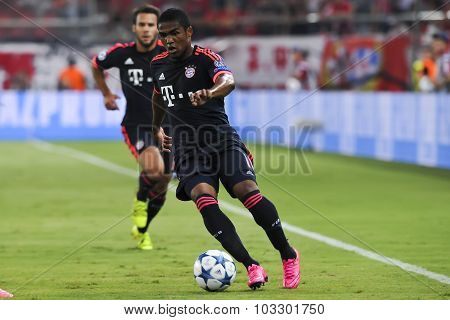 Douglas Costa (r) And Arturo Vidal (l) During The Uefa Champions League Game Between Olympiacos And