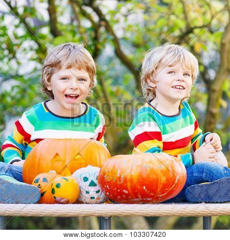 Two Little Friends Boys Making Jack-o-lantern For Halloween In A