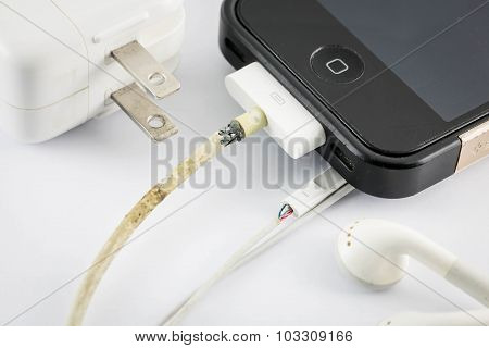 Nakhonratchasima, Thailand September 17, 2015 : Close Up Iphone Broken Old Charger On White Backgrou