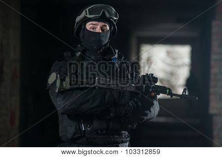 Fully equipped military men with automatic weapons playing airsoft strikeball