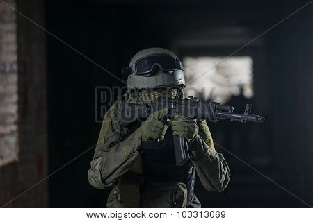Fully equipped military men with automatic weapons playing airsoft strikeball