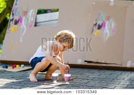 Little Kid Boy Painting Big Paper House With Colorful Paintbox