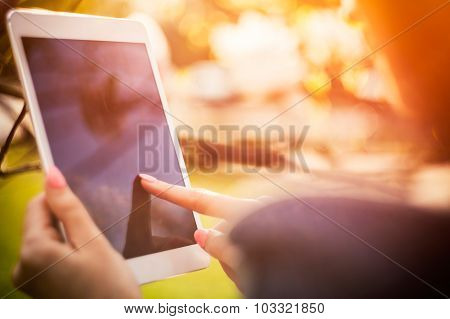 Girl Using Tablet Or Ebook Outdoor Closeup Screen