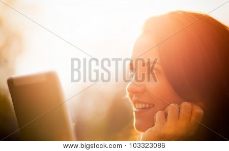 Beautiful Girl With Tablet Or Ebook Outdoor