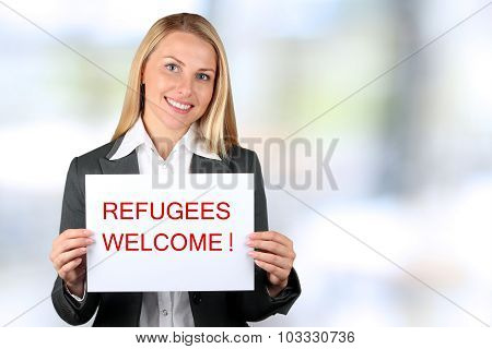 Smiling Woman Holding A White Banner With Words 