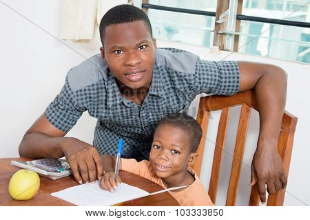 Shpplboy studying with his home teacher.