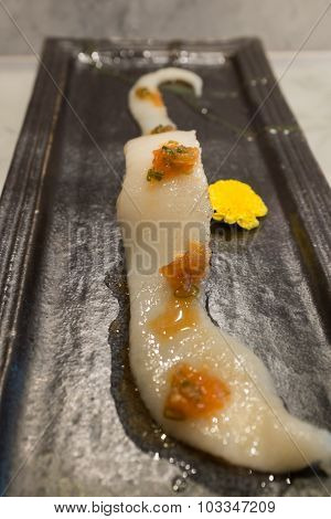 Engawa Sushi on black ceramic plate