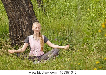 Beautiful Young Woman Relaxing In Forest Under The Tree