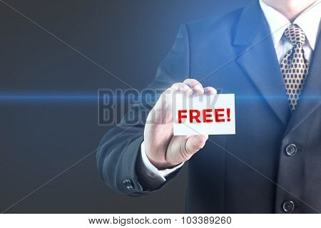 A Businessman holding a white sign with the message free.