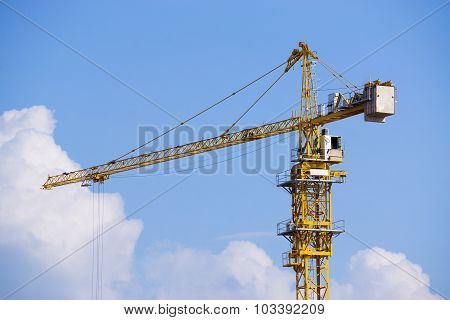 Construction Tower Crane Against Bluesky With Clouds.