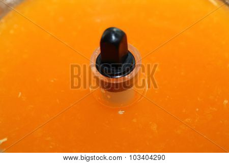 Fresh Orange Juice In Juicer Machine With Hand