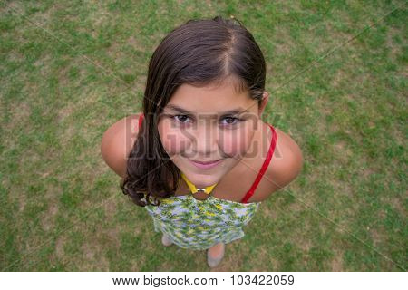 Child Face Smiling Girl Shot From Above Perspective In Grass