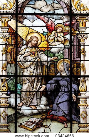 ZAGREB, CROATIA - MAY 28: Jesus and Saint Margaret Mary Alacoque, stained glass window in the Basilica of the Sacred Heart of Jesus in Zagreb, Croatia on May 28, 2015
