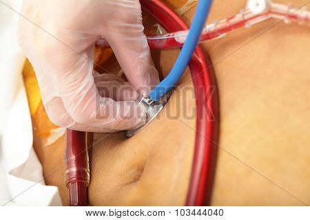 Surgeon Tirelessly Monitors The Well-being Of The Patient