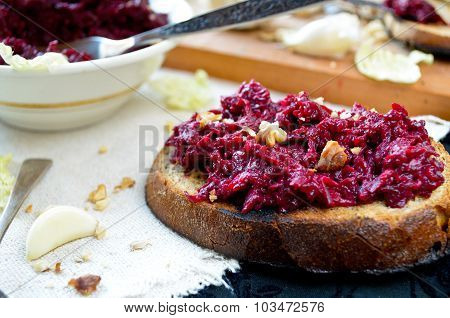 Fresh beet salad with garlic and walnuts