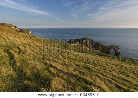 Stunning Natural Cove Coastal Landscape At Sunset With Beautiful Vibrant Sky