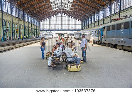 Unidentified People Wait At  The Train Station In Budapest