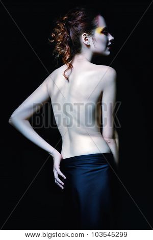 Gloomy Portrait Of Vampire Woman Among The Dark. Rear View