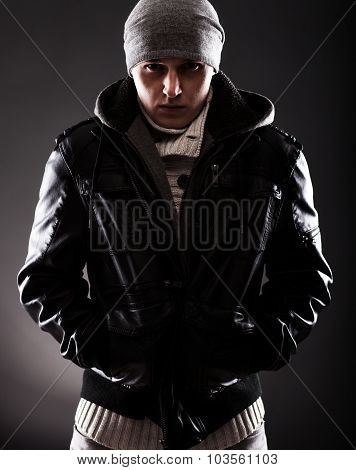 Young Man In Winter Clothes Shivering From Cold