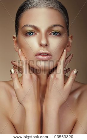 Vogue Style. Young Woman With Bronzed Skin
