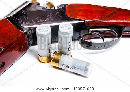 Hunting Shotgun And Ammunition On White Background.