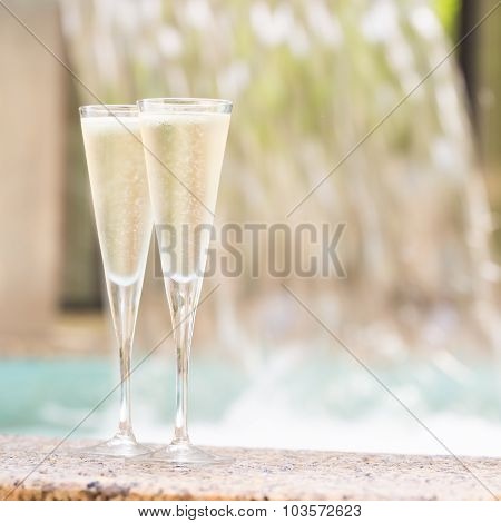 Two Glasses Of Champagne Near Outdoor Jacuzzi
