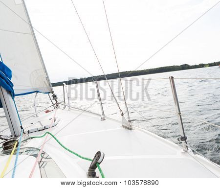 Front Part Of Yacht Swimming On Lake.