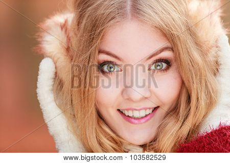 Portrait Of Pretty Smiling Woman In Earmuffs.