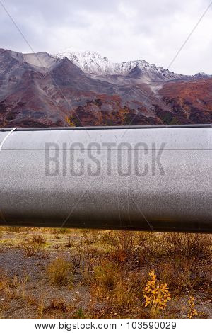 Oil Transport Alaska Pipeline Cuts Across Rugged Mountain Landscape