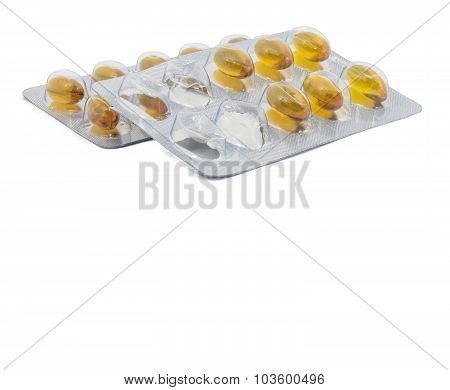 Yellow food supliment tablet with white background