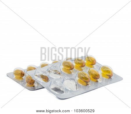 Yellow food supliment tablet with white background