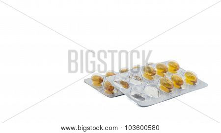 Yellow food supliment tablet with white background