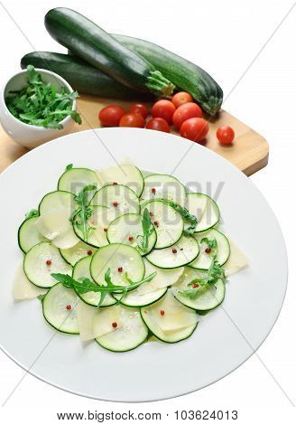 Salad Of Zucchini With Cheese And Arugula On Isolated Background