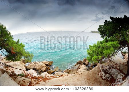 Stairs To The Beach, Clear Water And Cloudy Sky In Croatia Dalmatia