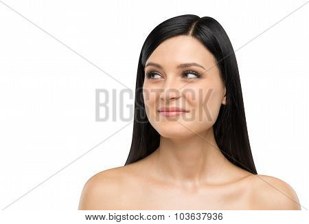 A Portrait Of A Smiling Brunette Lady Who Is Looking At Something On The Right Side. Isolated On Whi