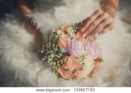 Wedding Bouquet Closeup In Bride's Hands